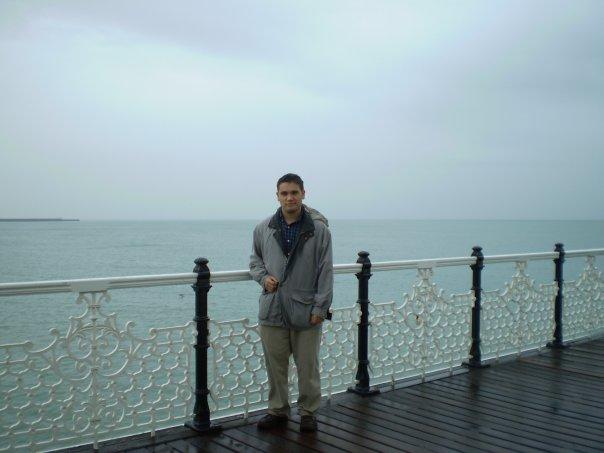 20_christopher_adam.jpg - Standing on Brighton Pier on a windy, rainy, dreary day.