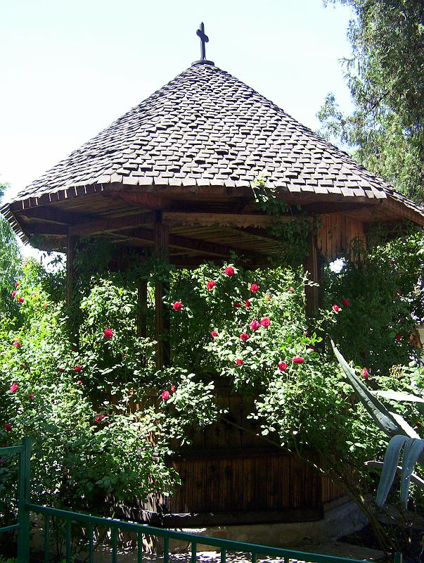 100_1814.jpg - A rose garden and gazebo behind an Orthodox church and monastery in Bucharest's city centre
